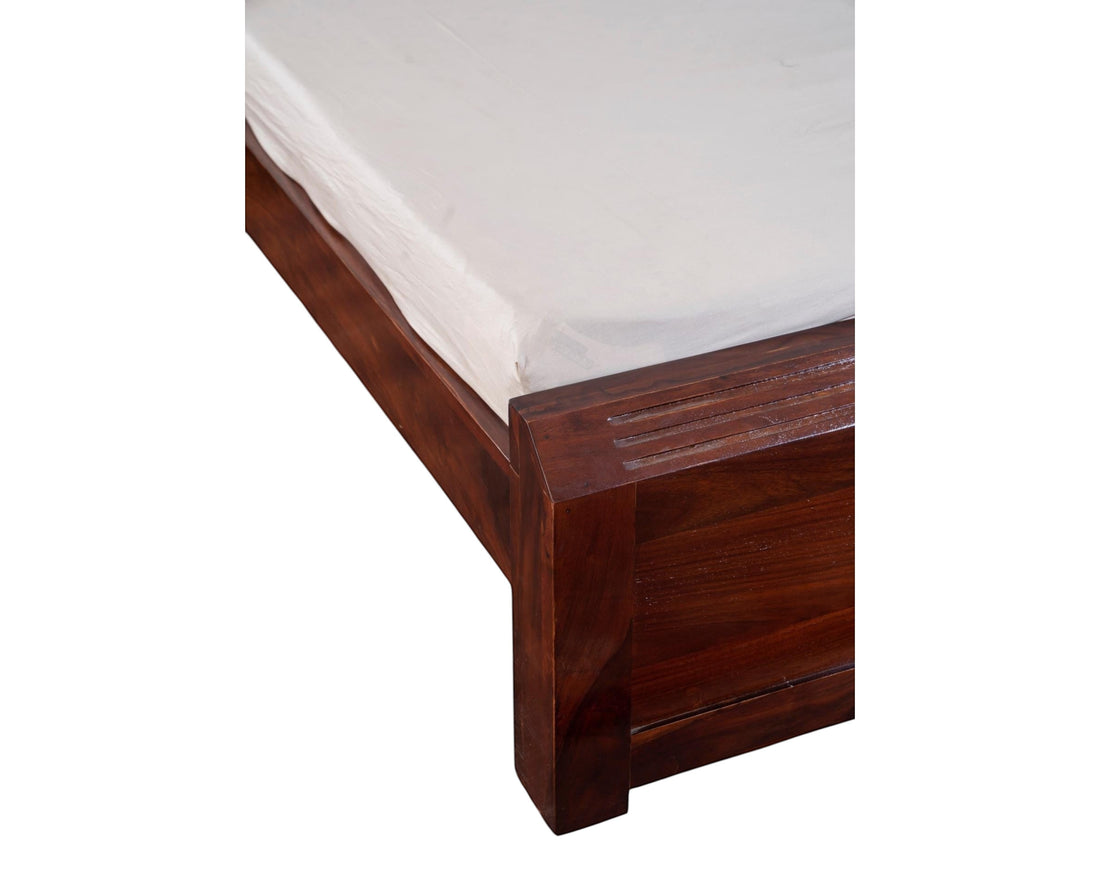 Nakoda Homes solid wood platform bed frame in warm brown with grooved headboard detail. Modern bedroom furniture.