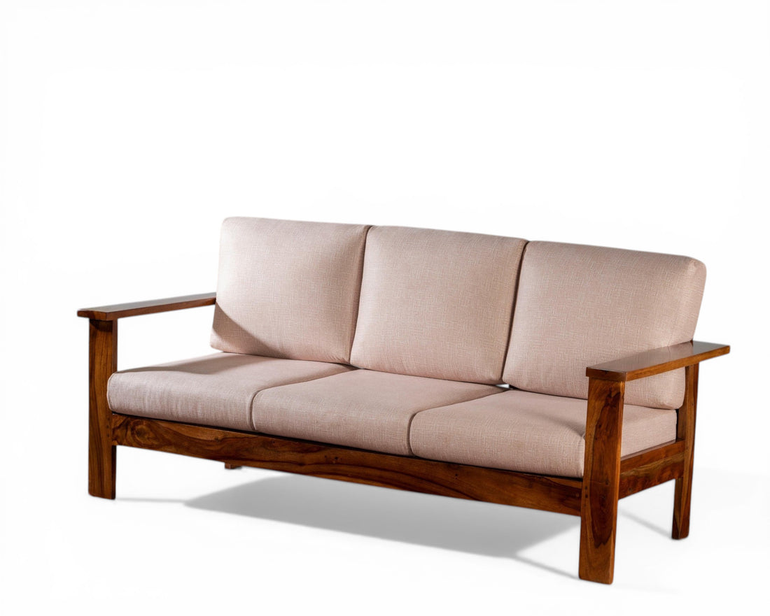 Nakoda Homes 3-seater sofa in light beige fabric with solid wood frame and arms. Modern, minimalist design.