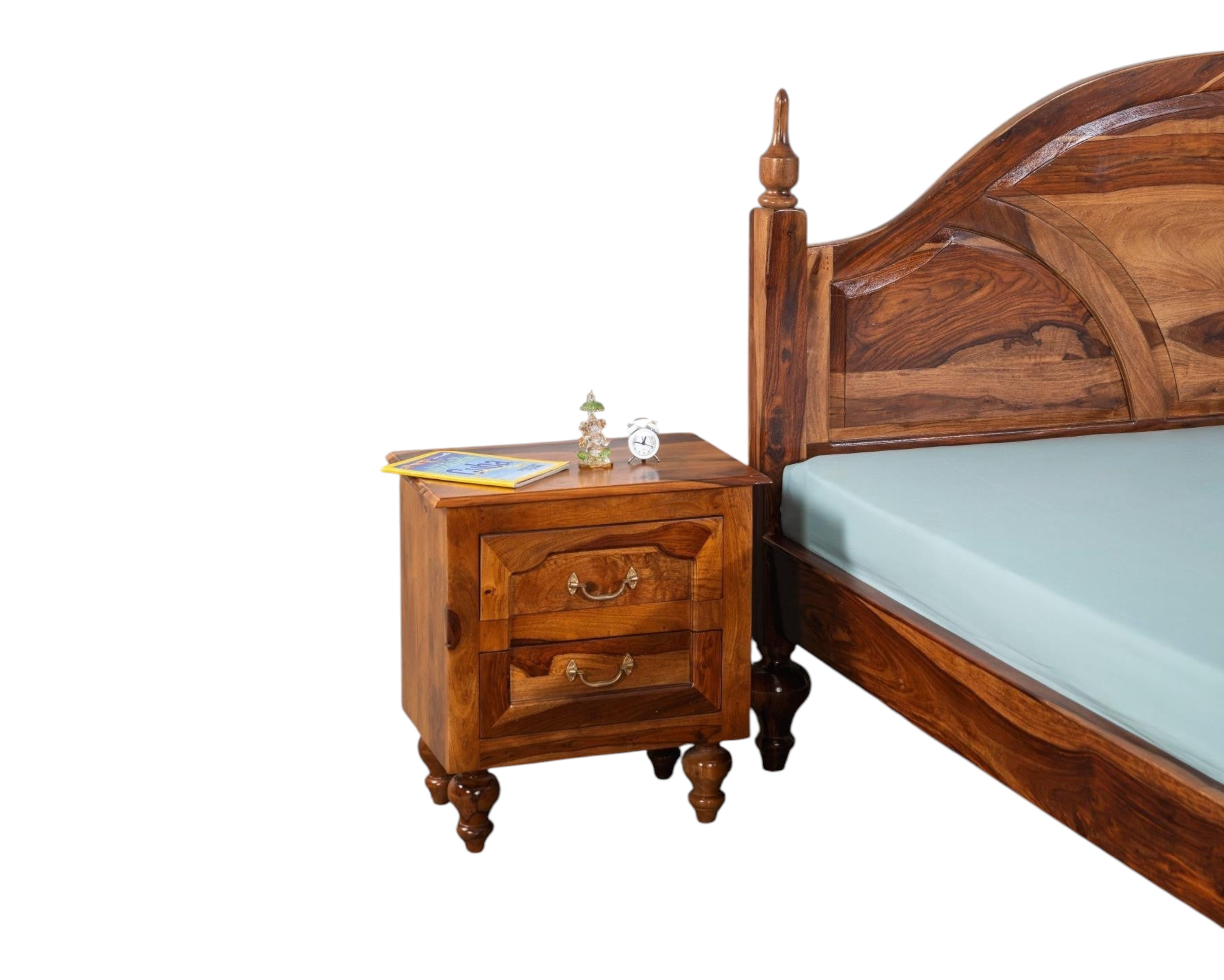 Nakoda Homes ornate Sheesham wood bed frame with arched headboard and carved posts. Classic design.