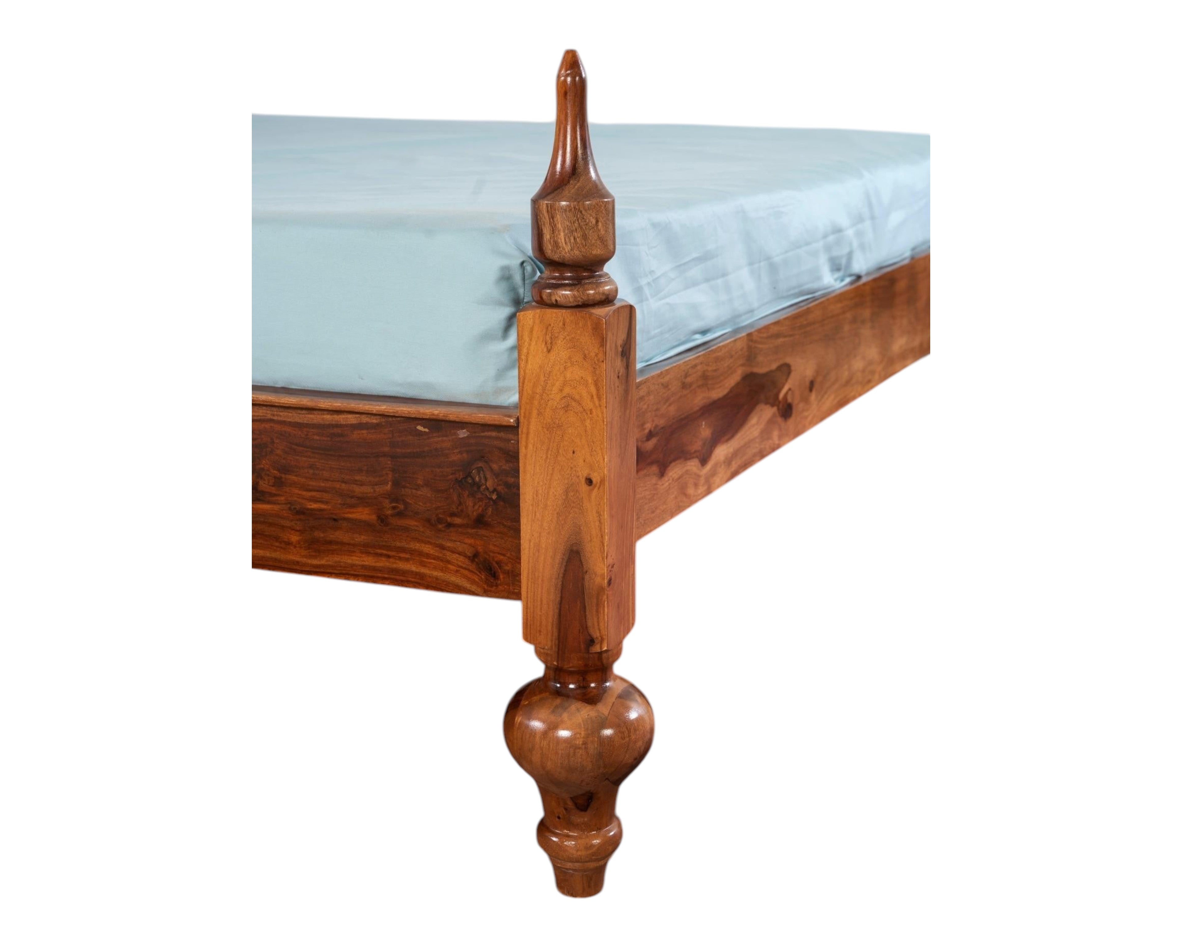 Nakoda Homes Ornate Sheesham wood bed frame with carved posts and arched headboard. Warm wood tone.