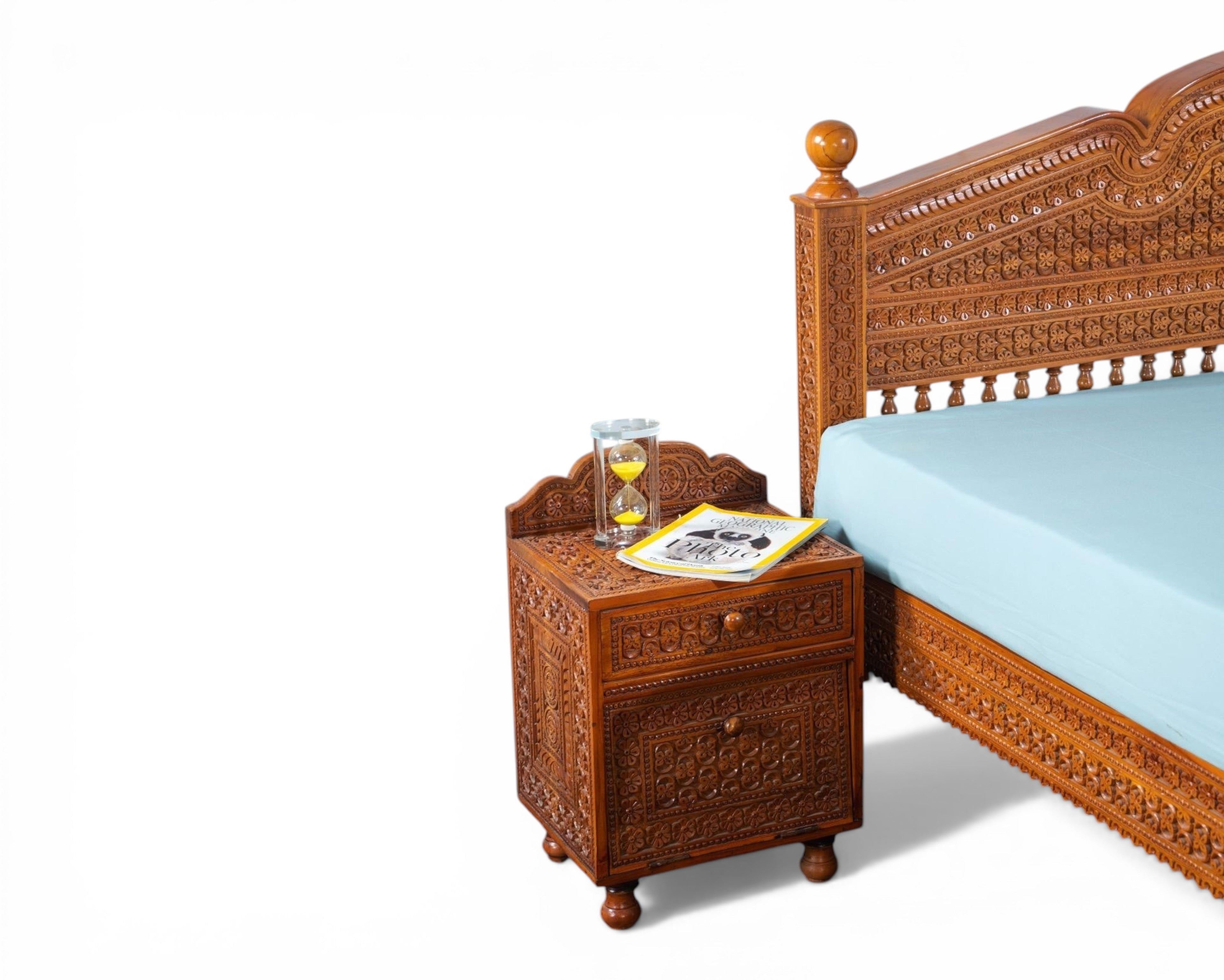Nakoda Homes ornate carved wooden bed frame with intricate details and warm wood finish. Traditional craftsmanship.