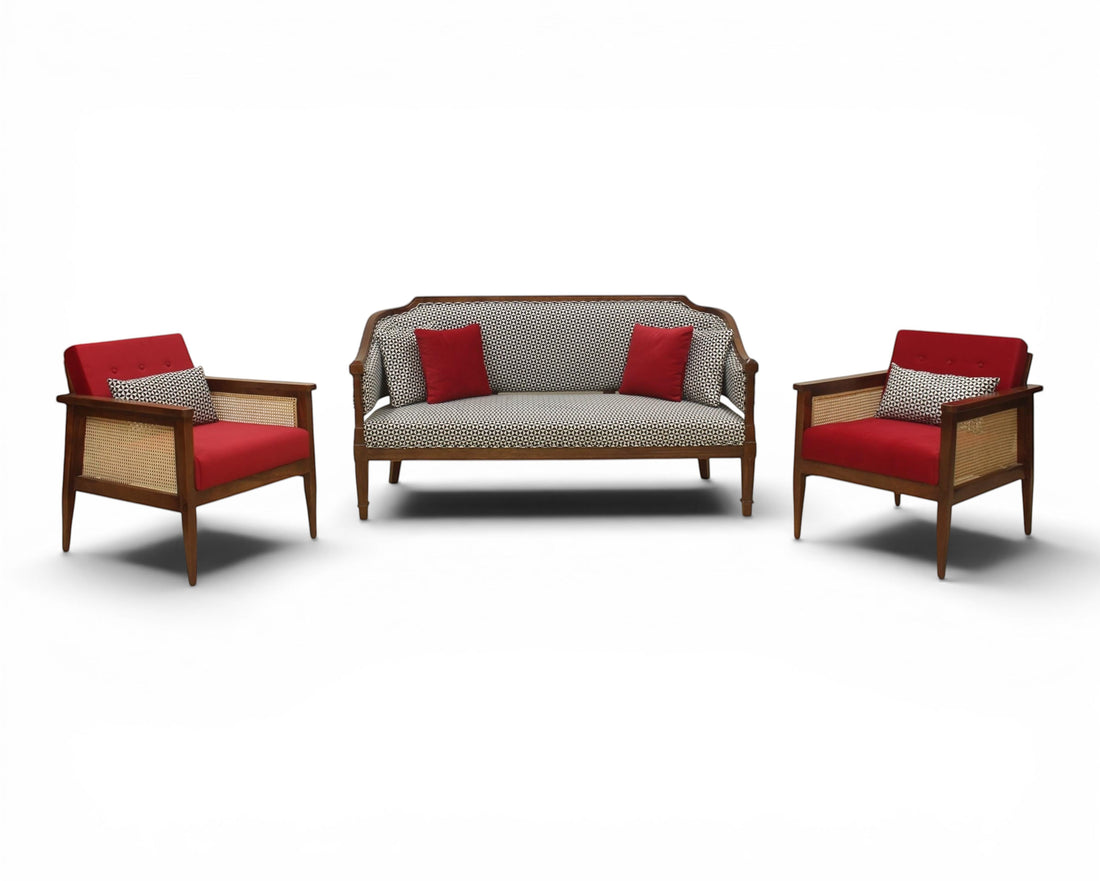 Nakoda Homes classic armchair and sofa set with red upholstery, wooden frame, cane detailing, and accent pillows.