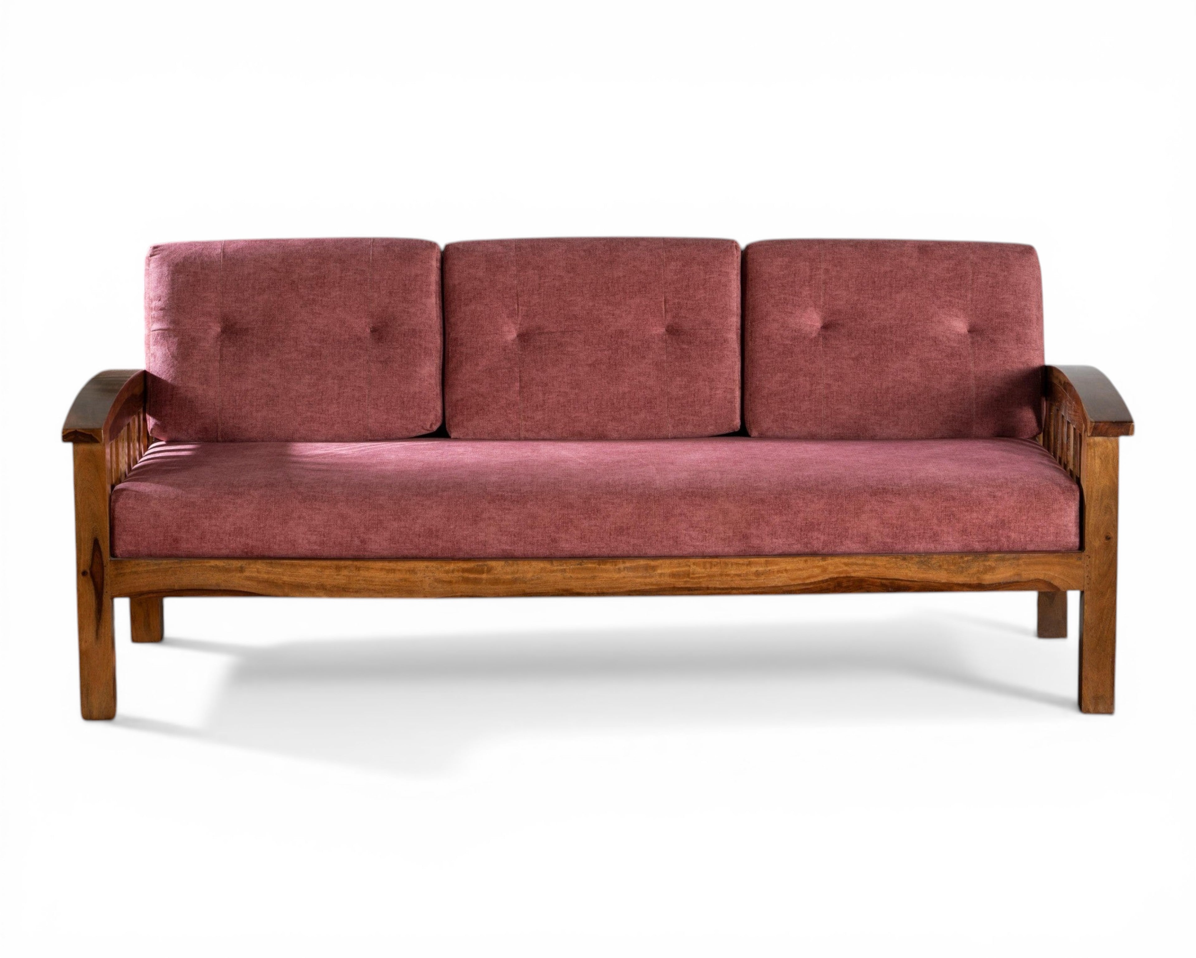 Nakoda Homes modern wooden sofa with rose-colored upholstery and slatted back design. Comfortable and stylish.