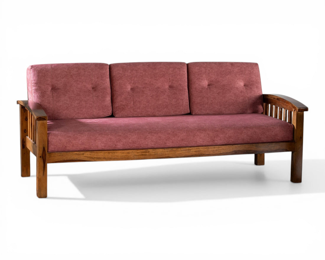 Nakoda Homes rose upholstered wooden sofa with slatted back design and plush cushions.
