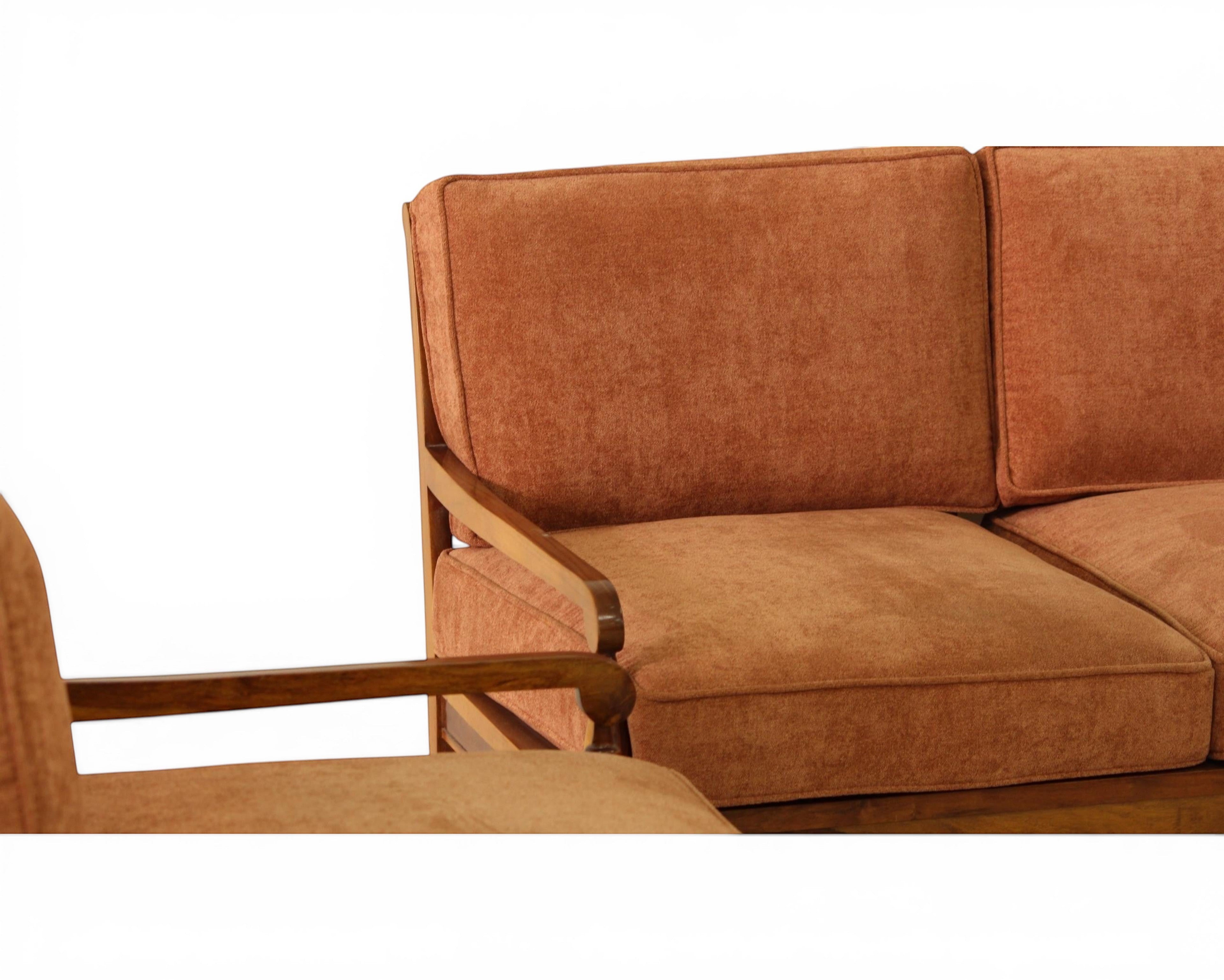 Nakoda Homes 3-piece rust-colored upholstered sofa set with wooden frame and armrests, featuring plush fabric and tan lumbar pillows.