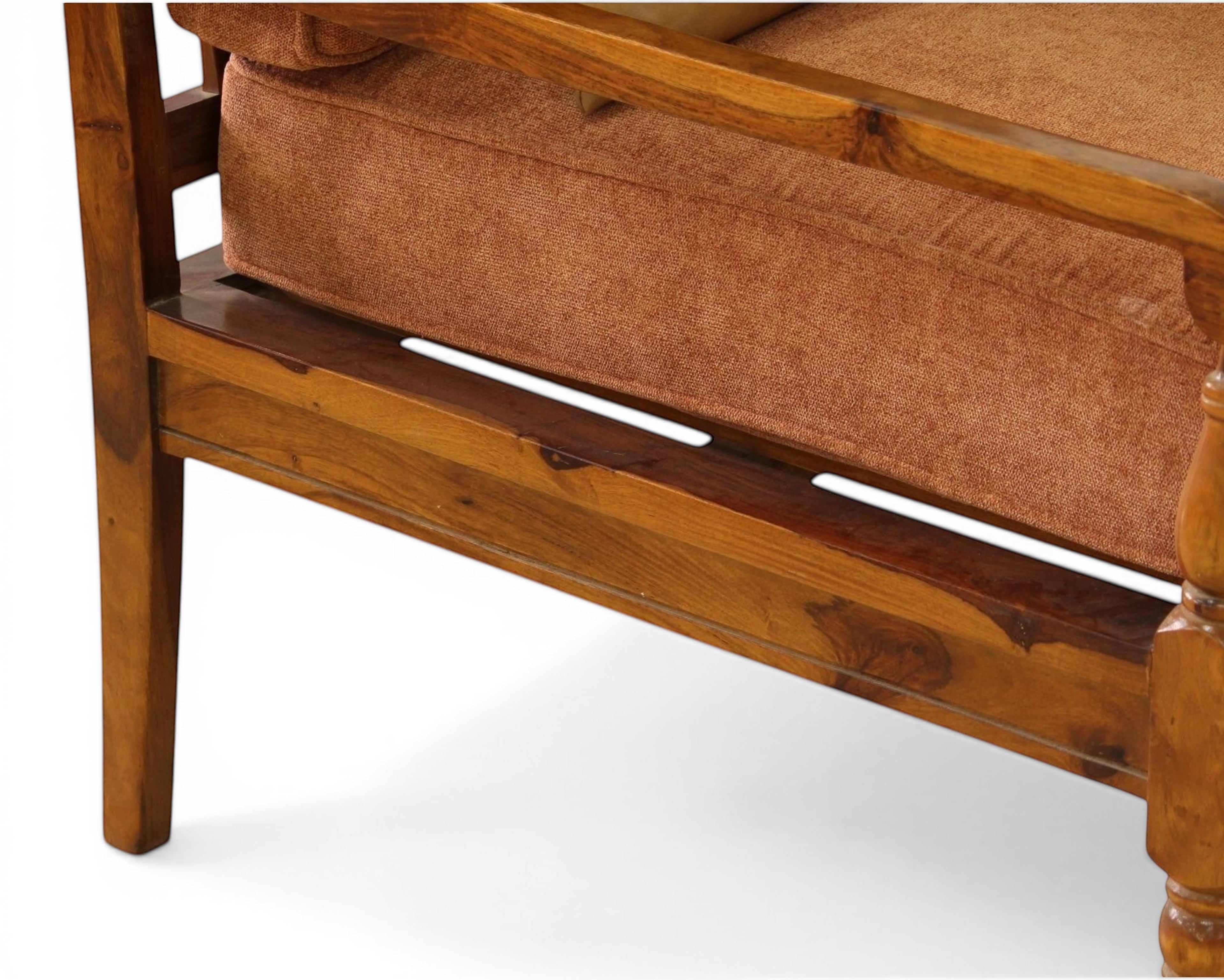 Nakoda Homes 3-piece sofa set with rust upholstered seats and wooden frame. Includes loveseat and armchairs.