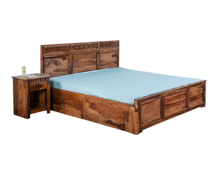 Nakoda Homes Sheesham wood bed frame with carved headboard, geometric patterns, and built-in storage drawers.