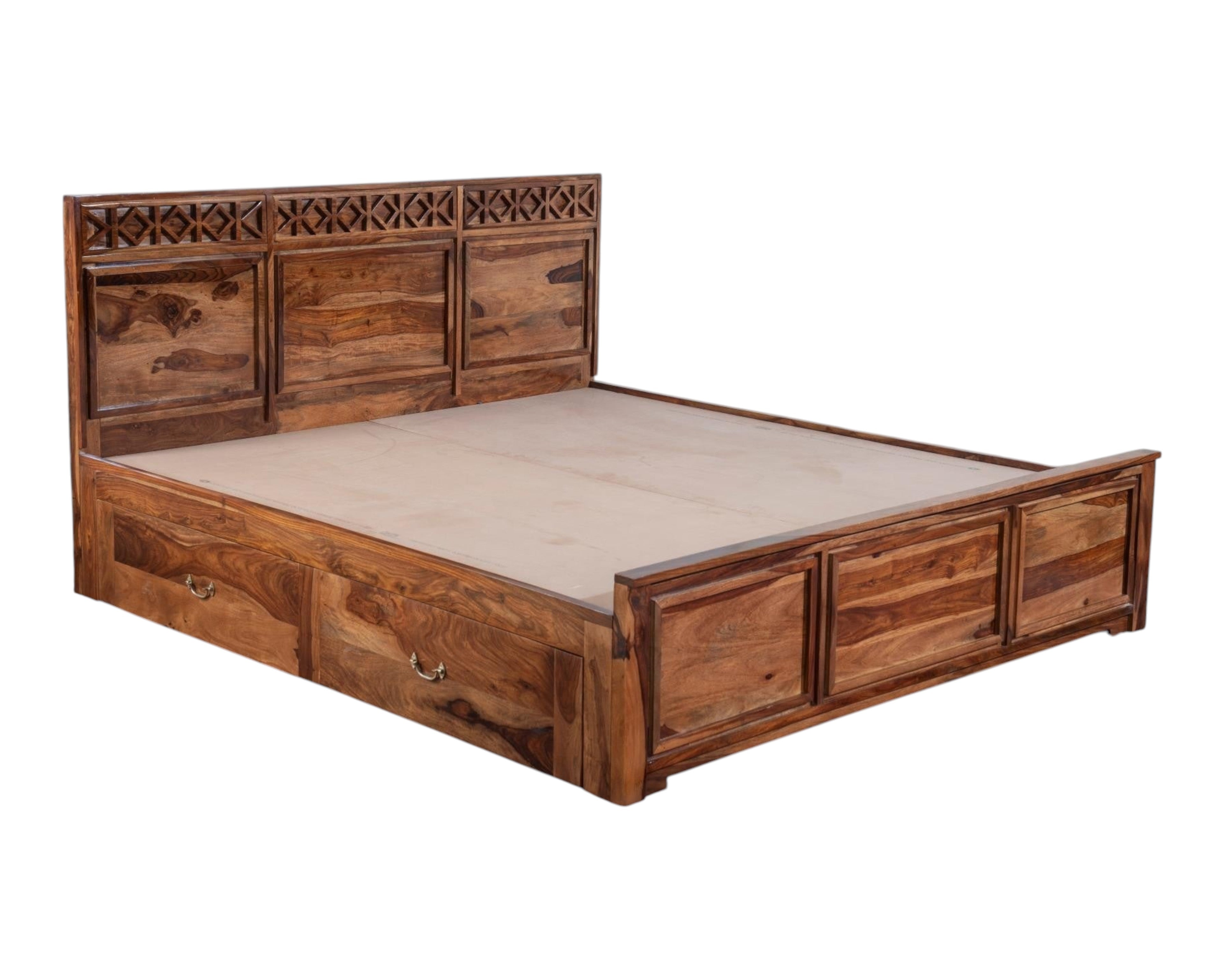 Nakoda Homes Sheesham wood bed frame with carved headboard and storage drawers. Rich wood grain.
