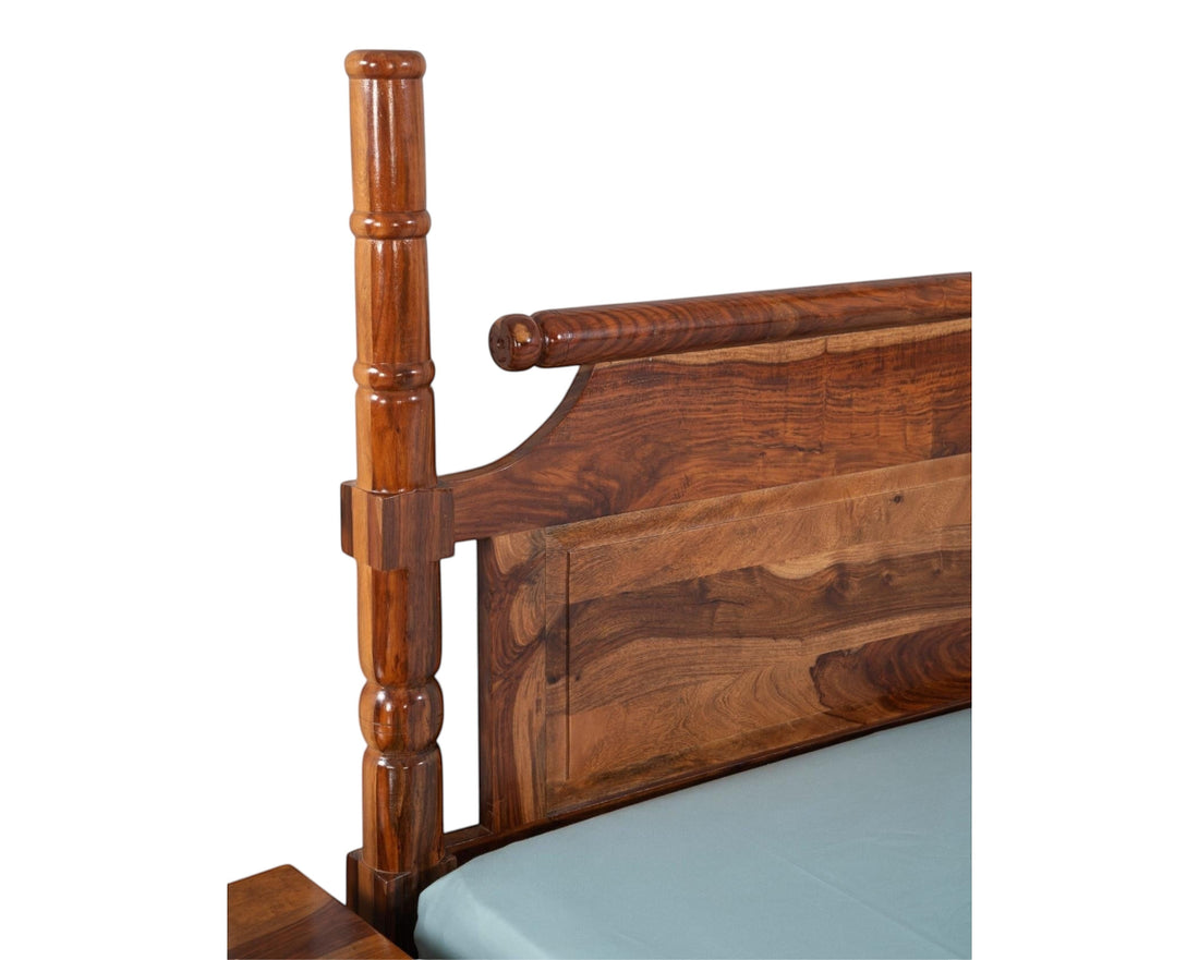 Nakoda Homes solid Sheesham wood queen bed frame with carved headboard and turned posts in honey brown finish.