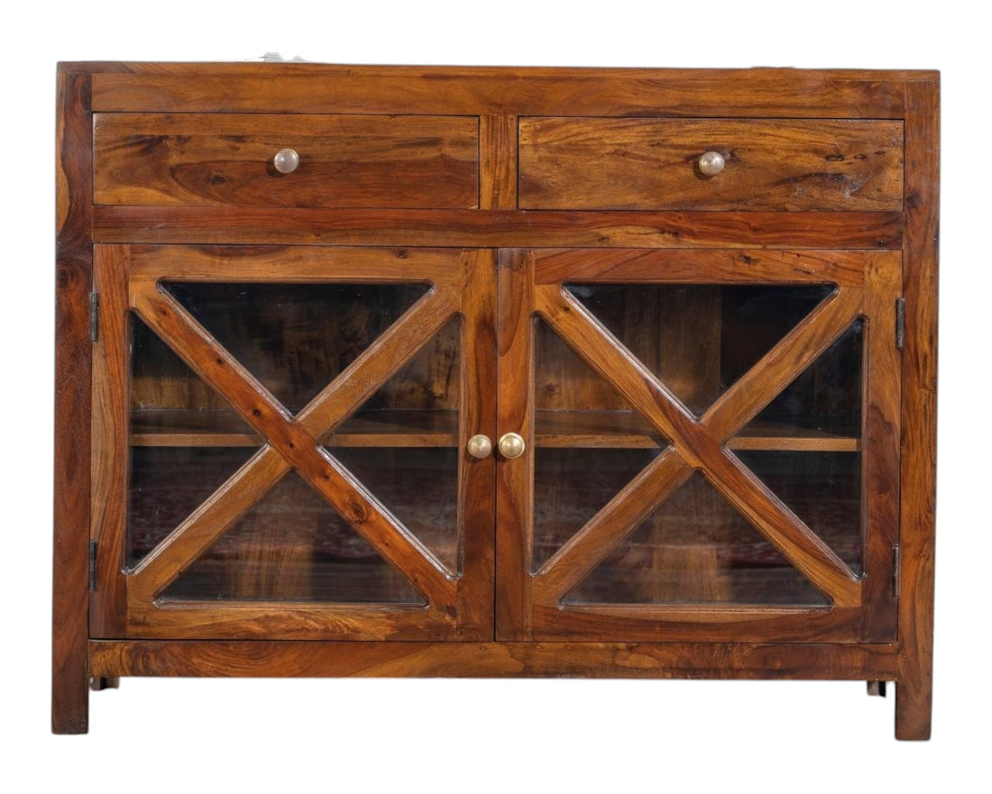 Nakoda Homes solid wood cabinet with two drawers and criss-cross glass doors. Warm wood tone, ideal for dining or living room storage.