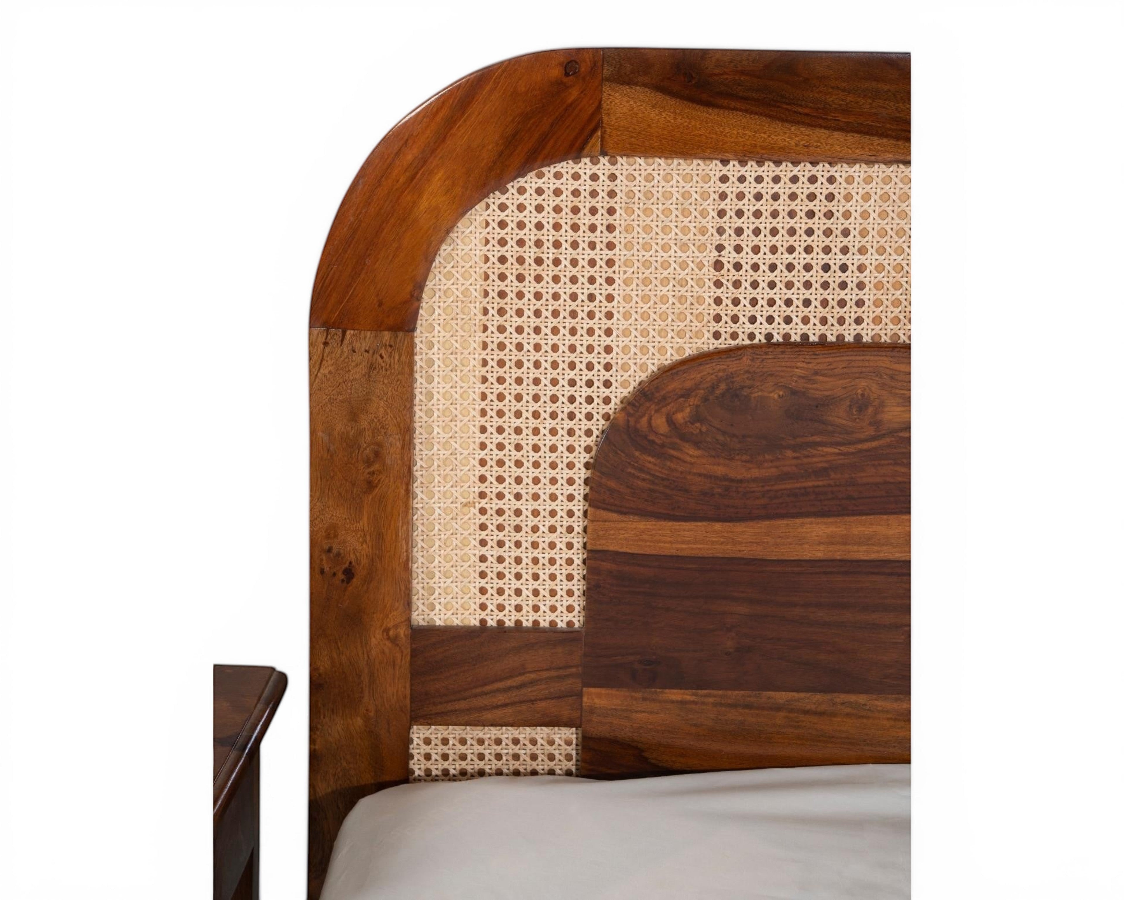 Nakoda Homes solid wood bed frame with natural cane headboard, warm wood finish, bohemian style.