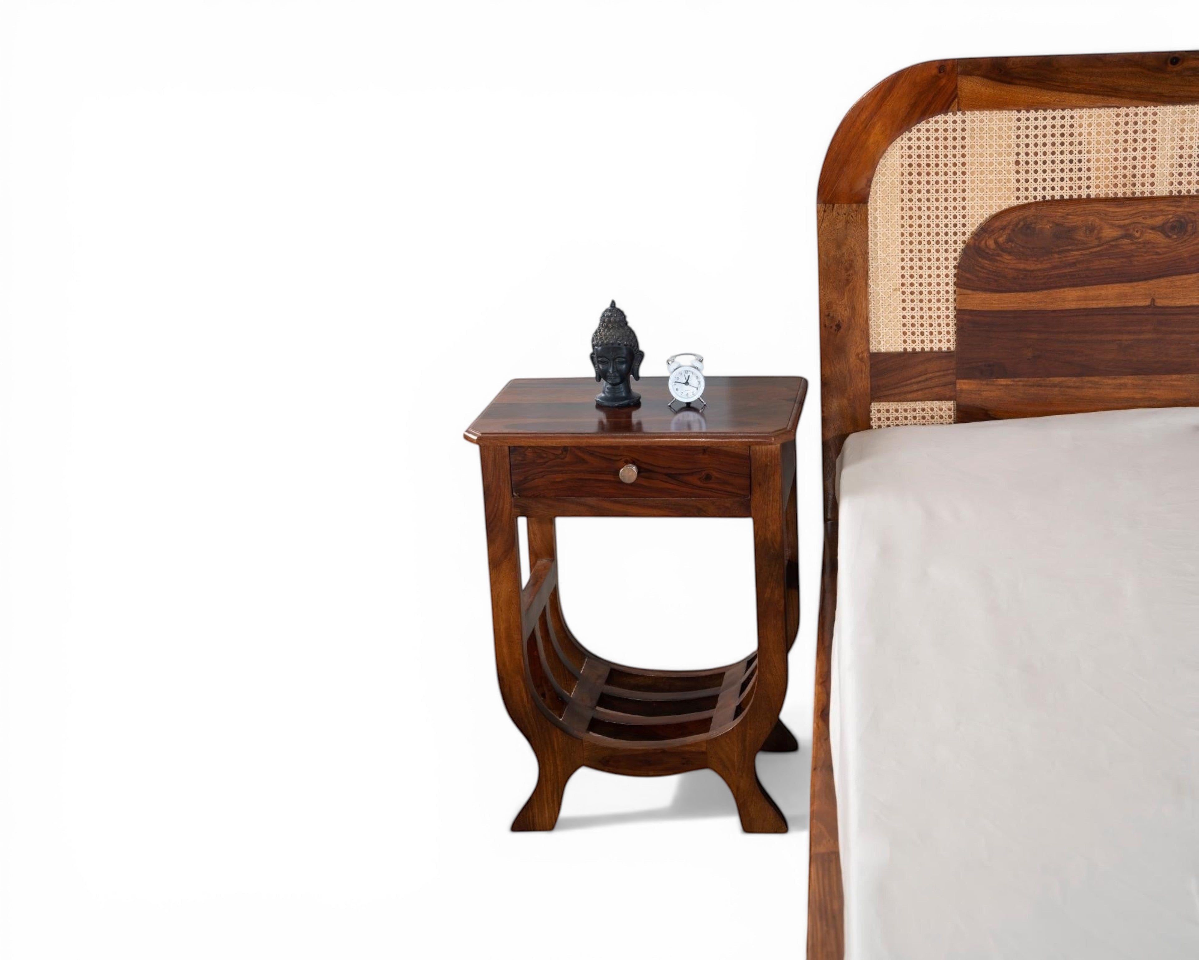 Nakoda Homes solid wood platform bed with natural cane headboard and storage drawers. Warm wood finish.
