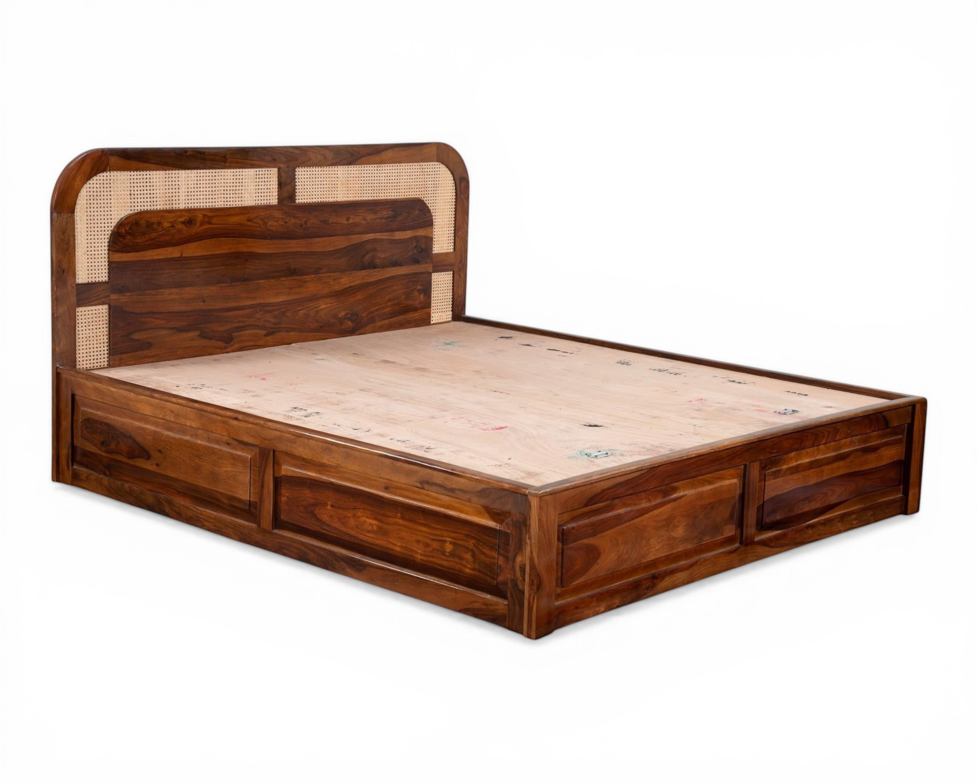Nakoda Homes solid wood platform bed with cane headboard and built-in storage drawers. Warm wood finish.