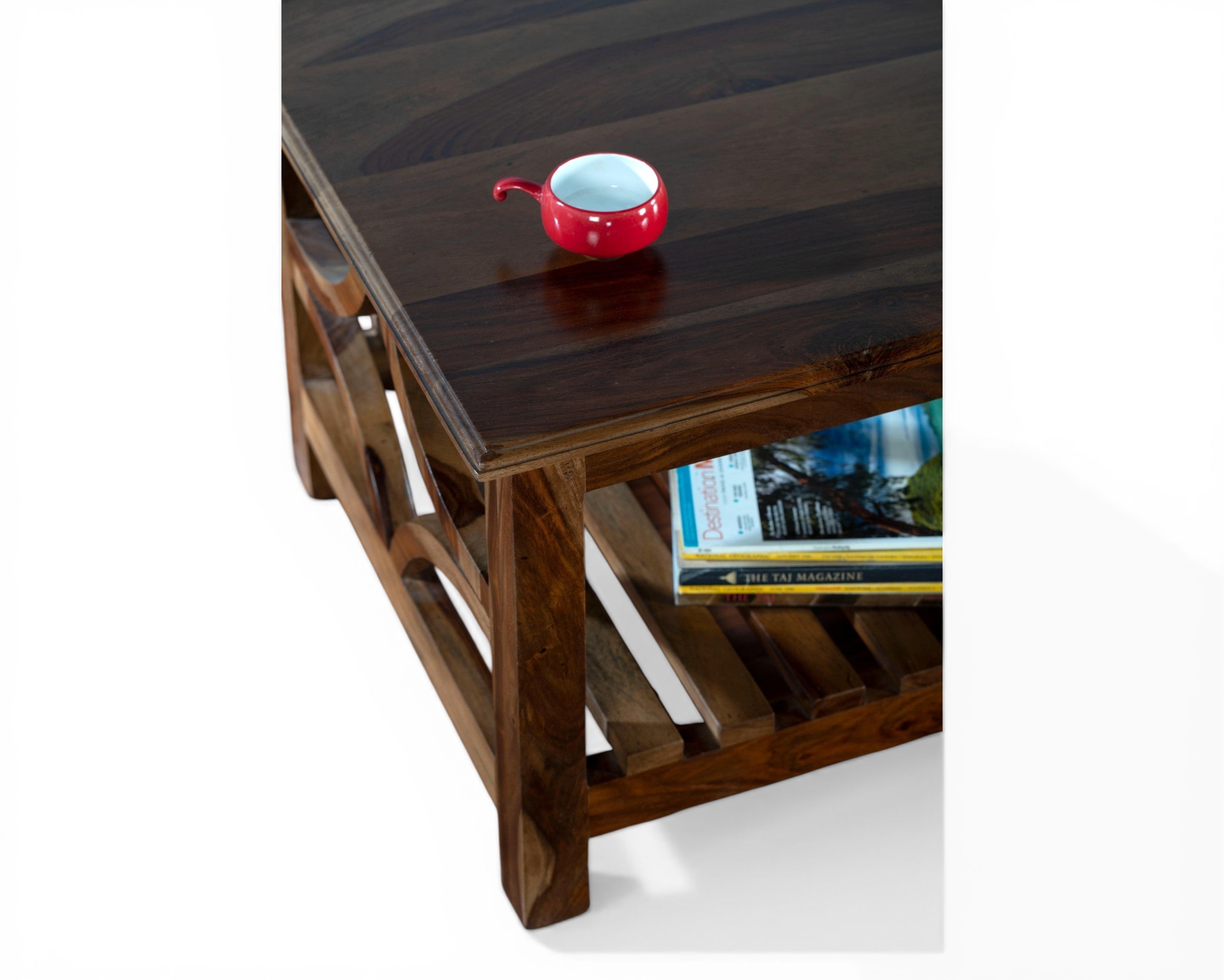 Nakoda Homes solid wood coffee table with geometric lattice sides and slatted shelf. Dark wood finish.
