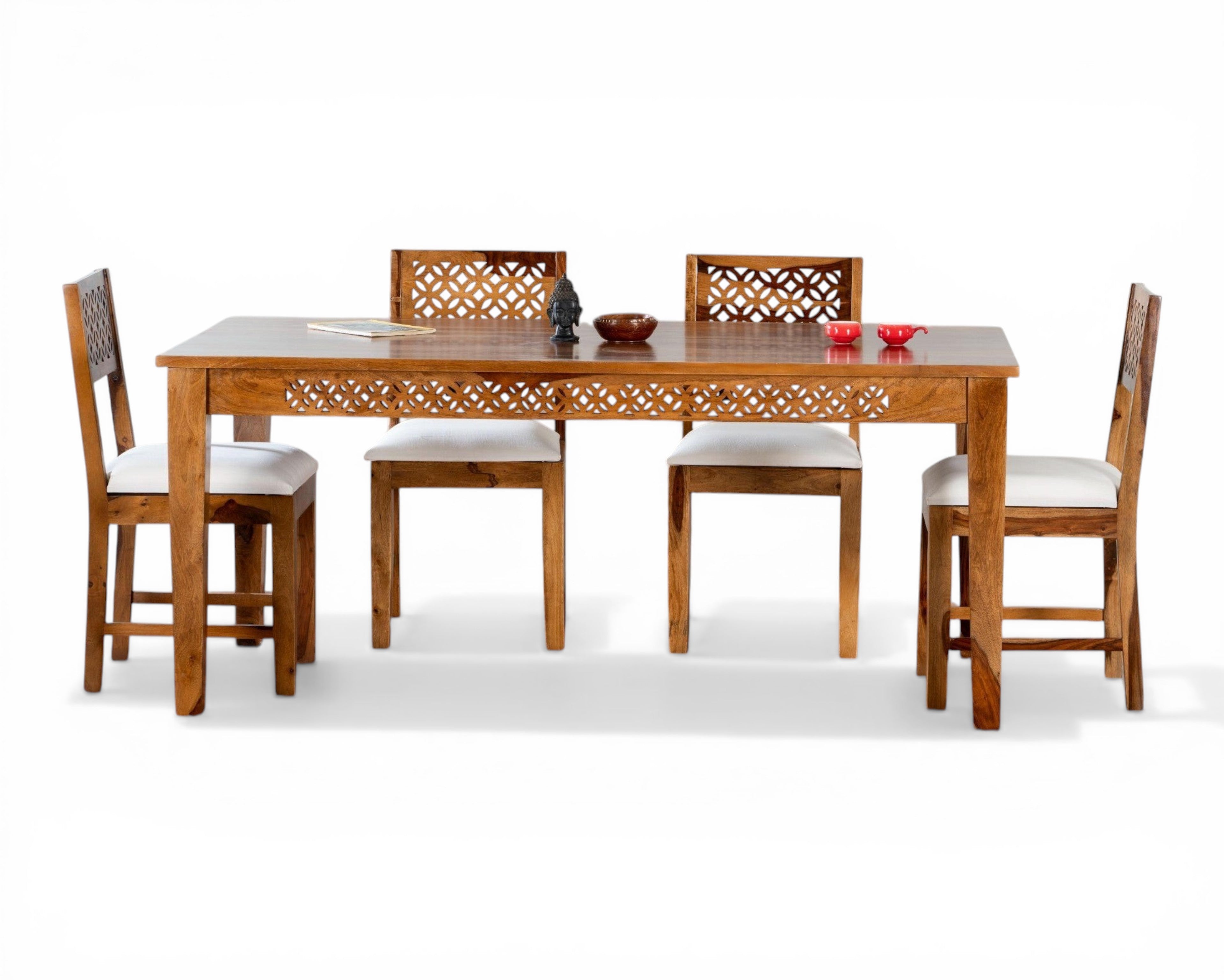 Nakoda Homes solid wood dining set with carved details and white cushioned seats. Includes 4 chairs and a dining table.