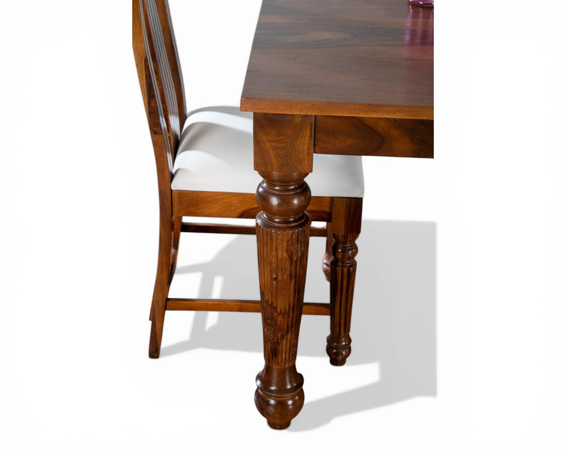 Nakoda Homes solid Sheesham wood dining set with carved legs and white upholstered seats.