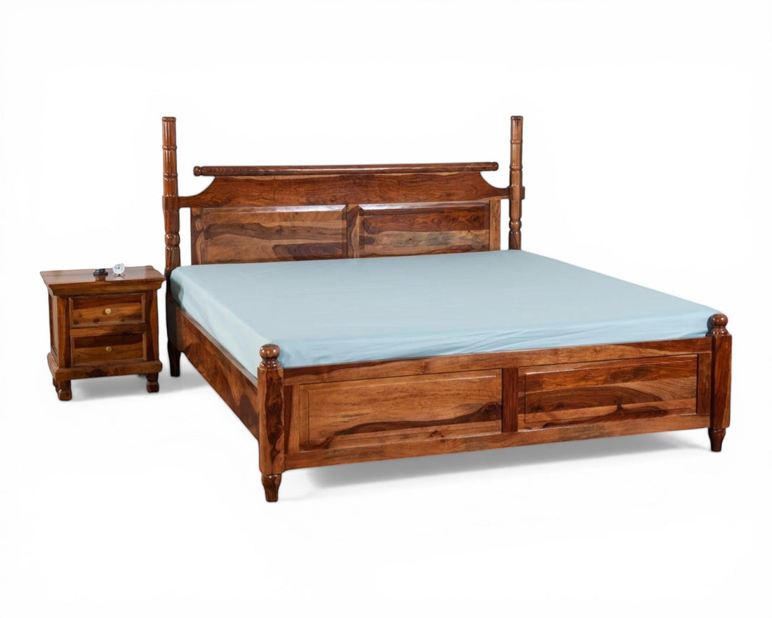 Nakoda Homes queen-size solid Sheesham wood four poster bed frame in honey brown with carved headboard and sturdy posts.
