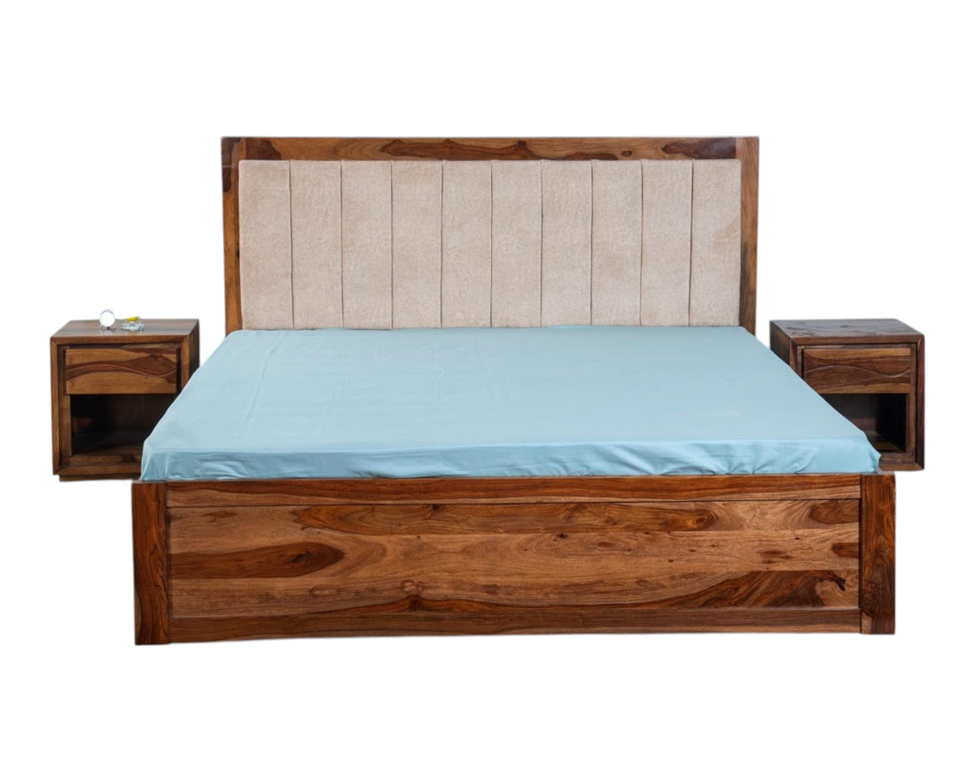 Nakoda Homes solid wood platform bed with upholstered beige headboard and storage drawers. Natural wood finish.