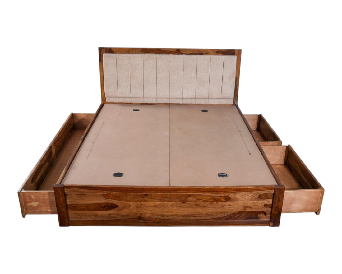 Nakoda Homes solid wood platform bed with upholstered headboard and four storage drawers. Natural wood finish.