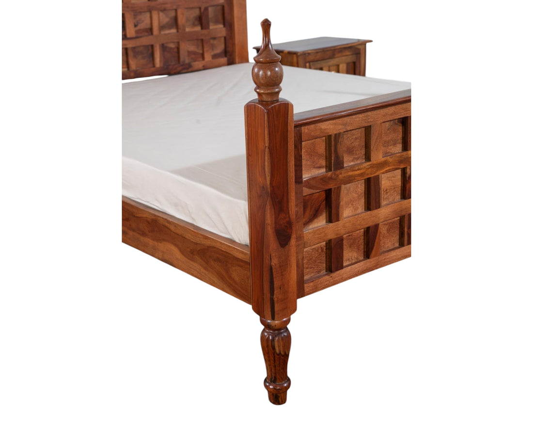 Nakoda Homes solid wood bed frame in warm brown with lattice headboard and turned posts. Traditional design.