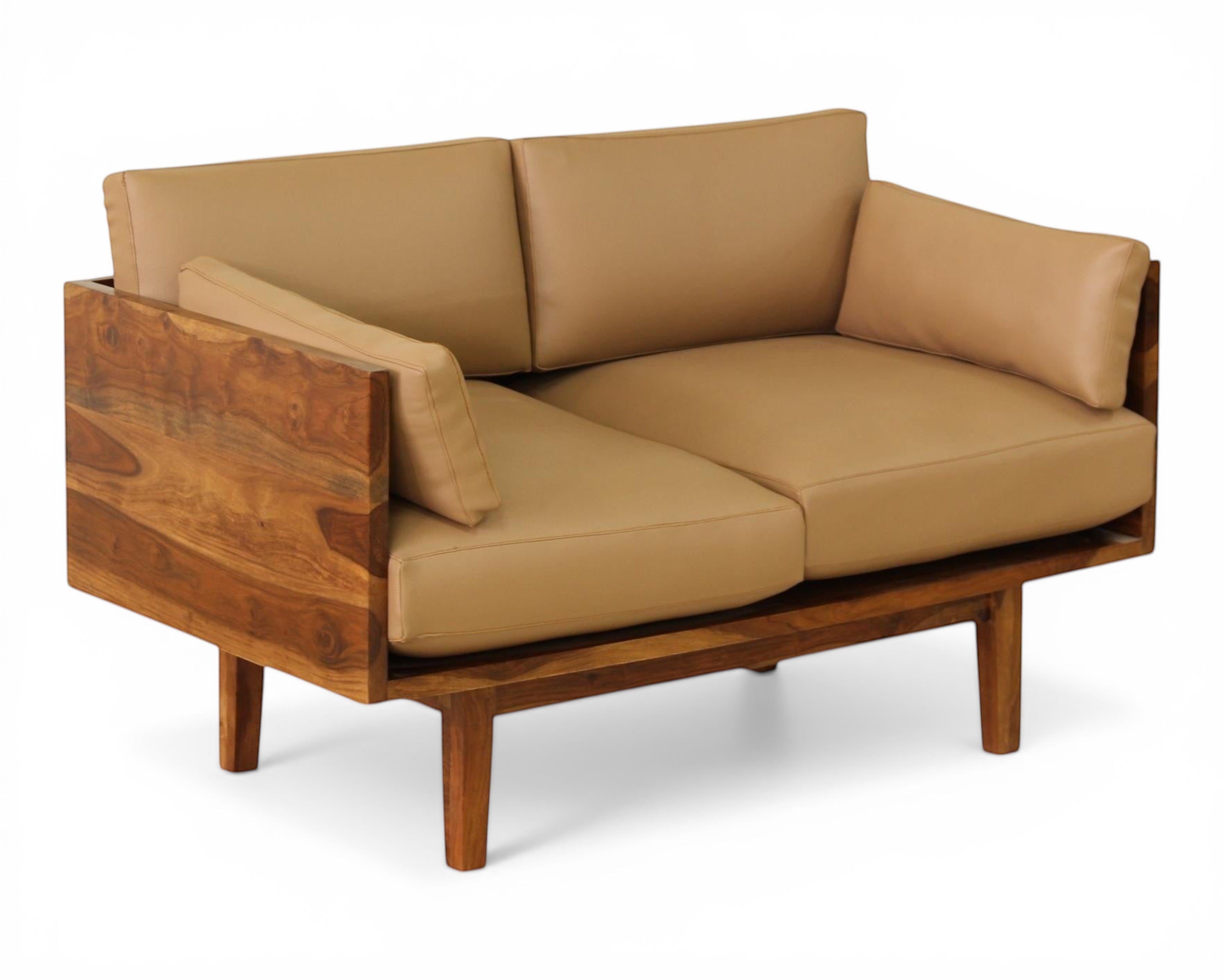 Nakoda Homes modern tan upholstered three-seater sofa with warm wood frame and clean lines.