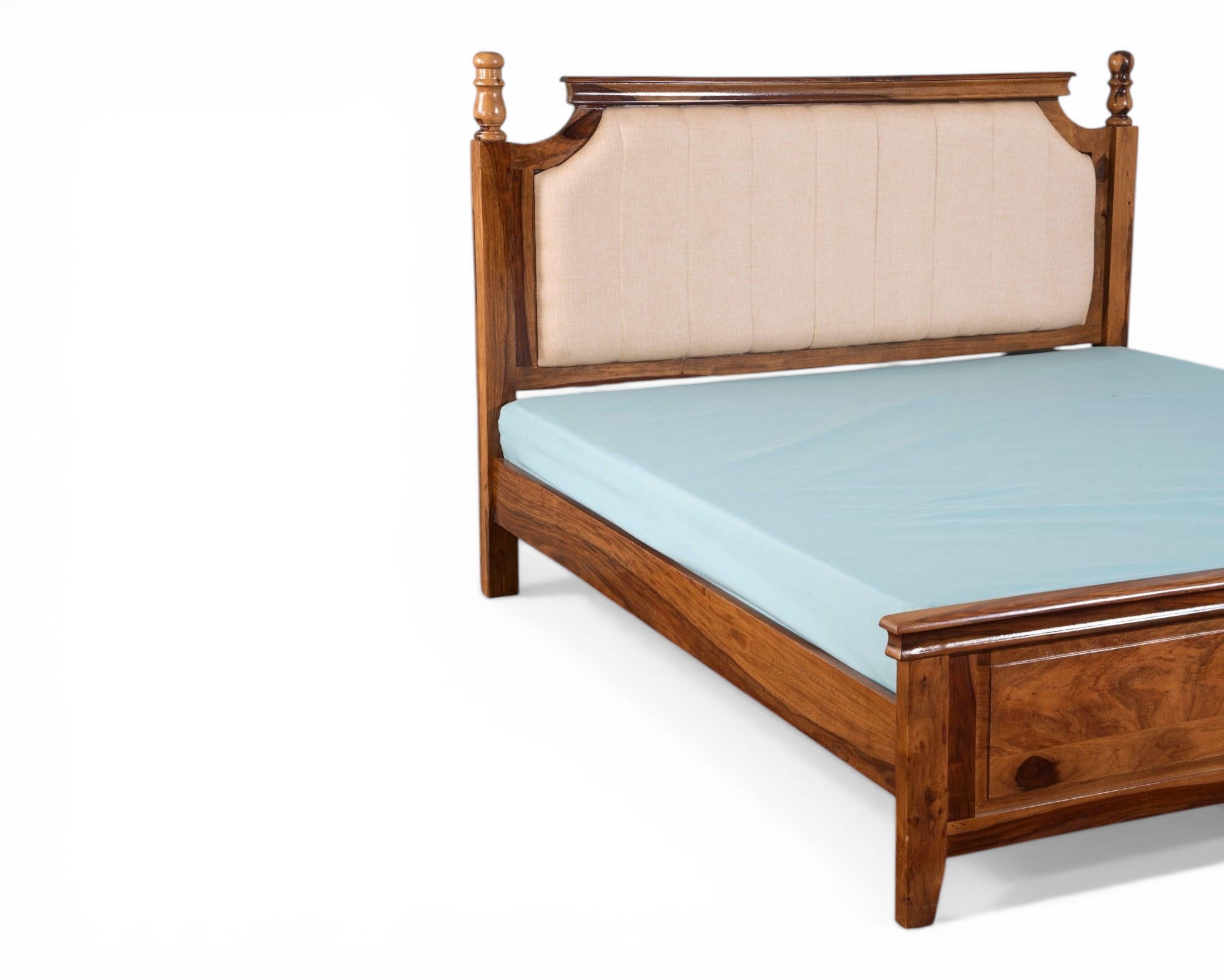 Nakoda Homes classic wooden bed frame with upholstered beige headboard and decorative wooden posts. Ideal for a sophisticated bedroom.